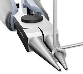 Wire being bent by chain-nose pliers.